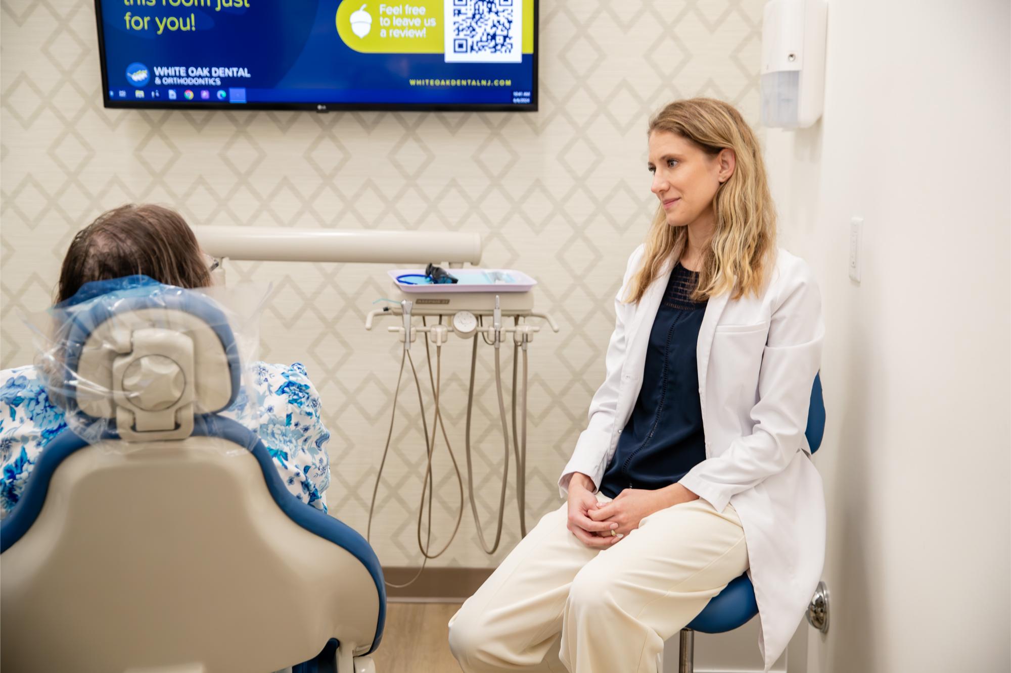 doctor and woman smiling